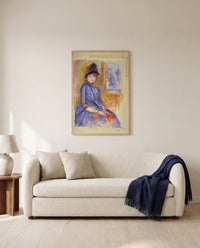 Young Girl in a Blue Dress by Pierre-Auguste Renoir framed in natural oak above a cream sofa in a warm living room