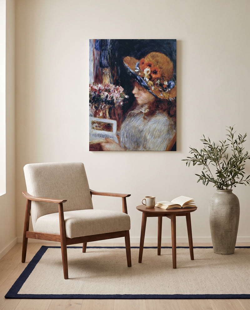Reading Girl by Pierre-Auguste Renoir as a stretched canvas above a linen lounge chair in a reading corner