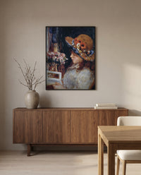 Reading Girl by Pierre-Auguste Renoir in a black frame above a walnut sideboard in a dining room