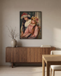 Girls Looking at an Album by Pierre-Auguste Renoir in a black frame above a walnut sideboard in a dining room