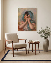 Young Woman Arranging Her Earring by Renoir as a stretched canvas above a linen lounge chair in a reading corner