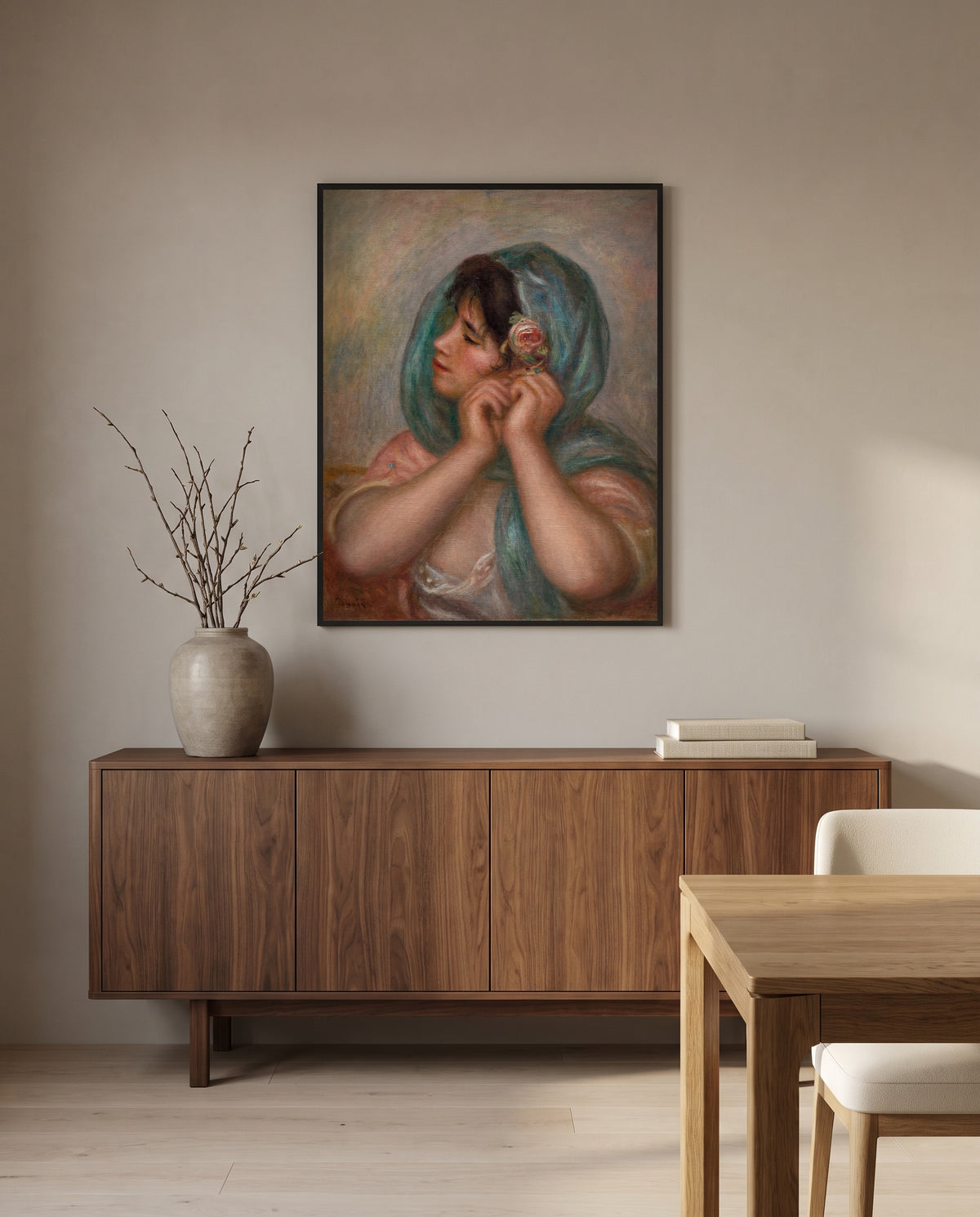 Young Woman Arranging Her Earring by Pierre-Auguste Renoir in a black frame above a walnut sideboard in a dining room