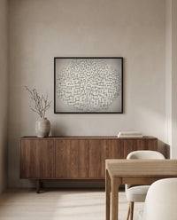 Composition 10 by Piet Mondrian in a black frame above a walnut sideboard in a dining room