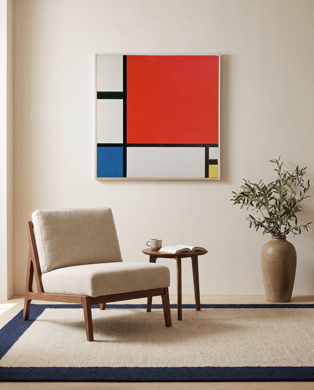 Composition II by Piet Mondrian as a stretched canvas above a linen lounge chair in a reading corner