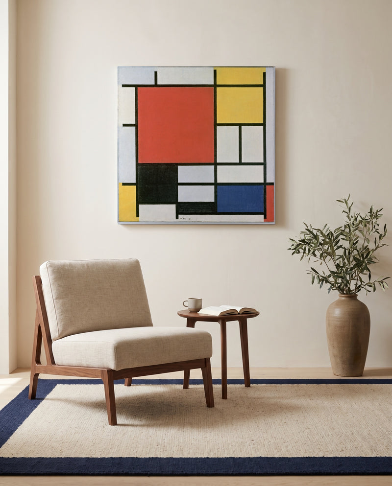 Large Red Plane by Piet Mondrian as a stretched canvas above a linen lounge chair in a reading corner
