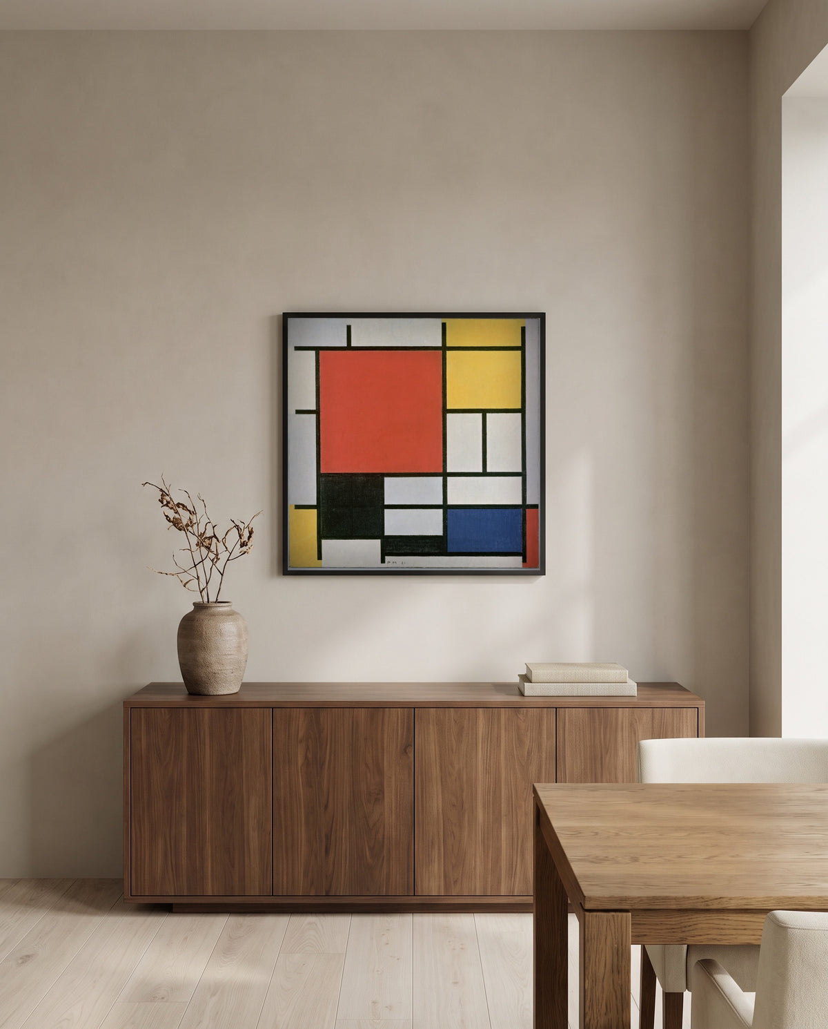 Large Red Plane by Piet Mondrian in a black frame above a walnut sideboard in a dining room
