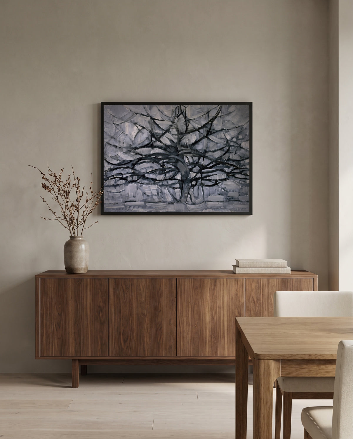 Gray Tree by Piet Mondrian in a black frame above a walnut sideboard in a dining room