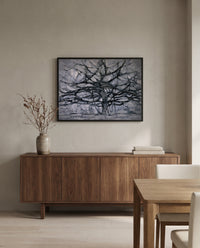 Gray Tree by Piet Mondrian in a black frame above a walnut sideboard in a dining room