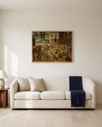 Children’s Games by Pieter Bruegel the Elder framed in natural oak above a cream sofa in a warm living room