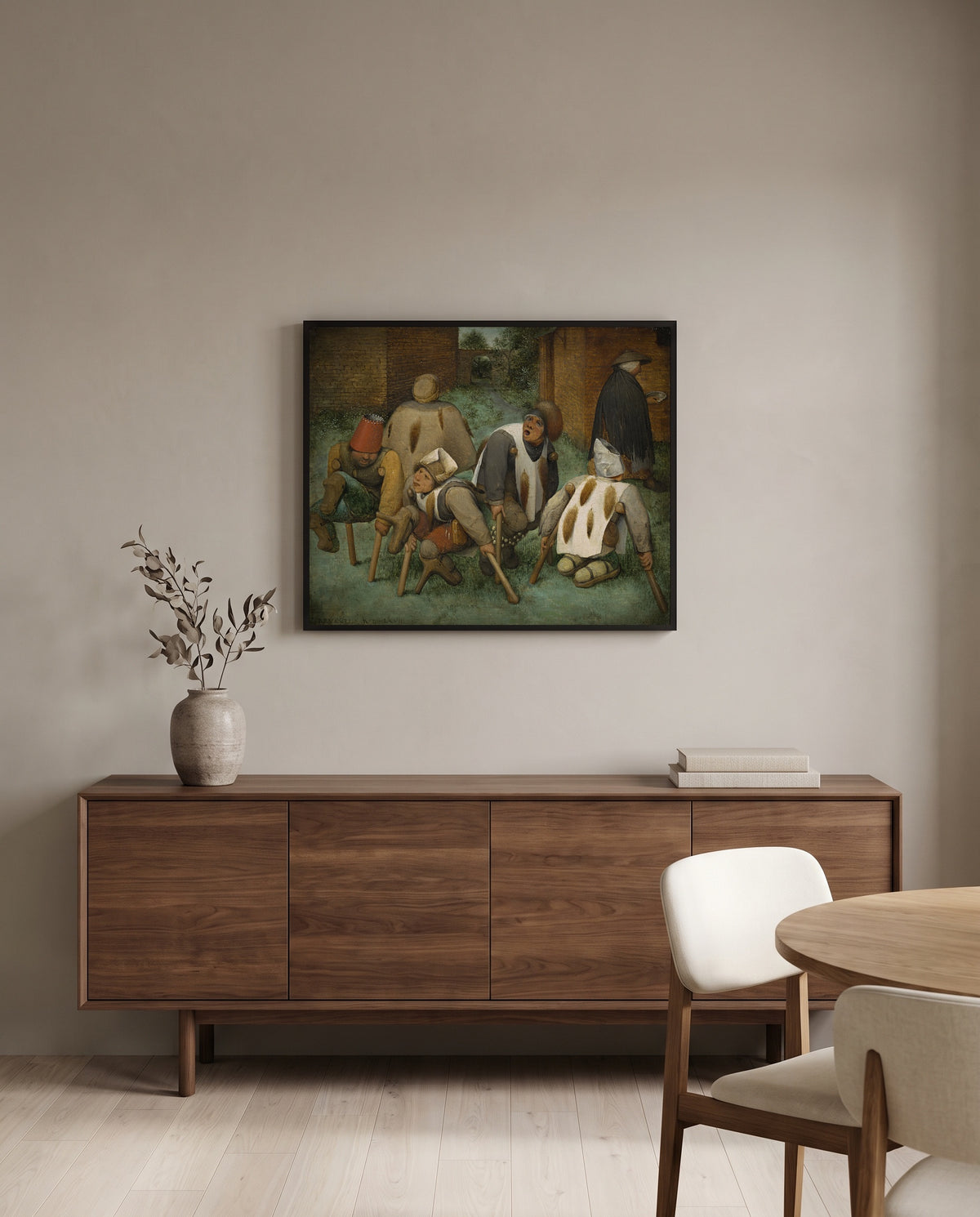 The Beggars by Pieter Bruegel the Elder in a black frame above a walnut sideboard in a dining room