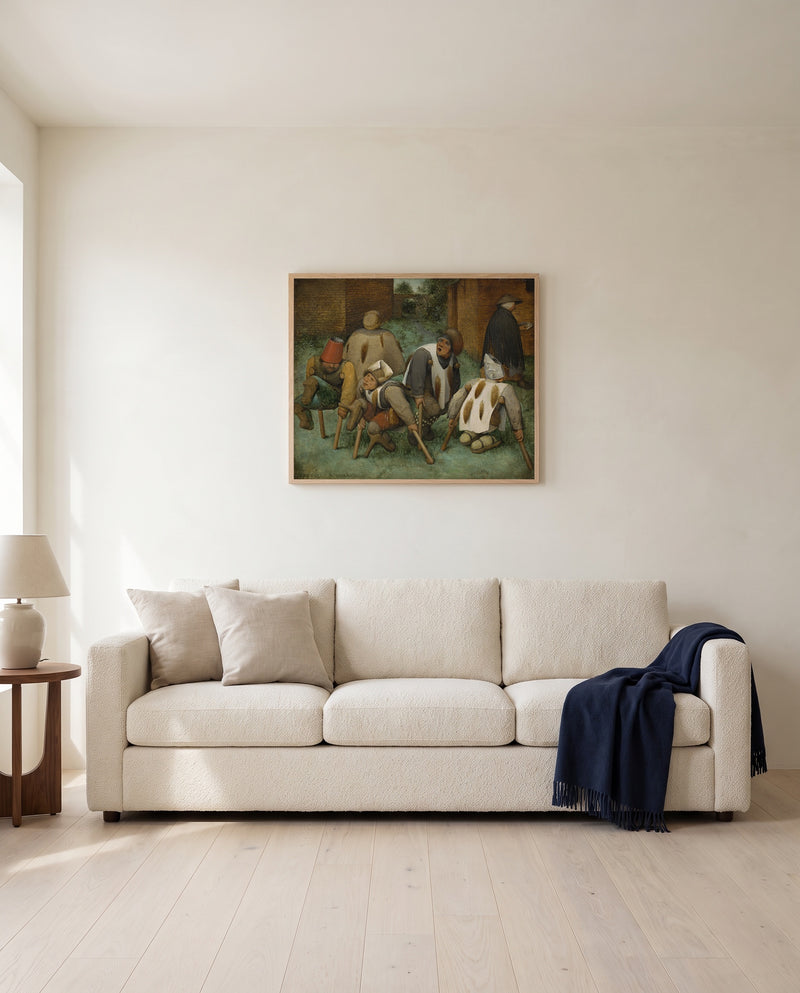 The Beggars by Pieter Bruegel the Elder framed in natural oak above a cream sofa in a warm living room