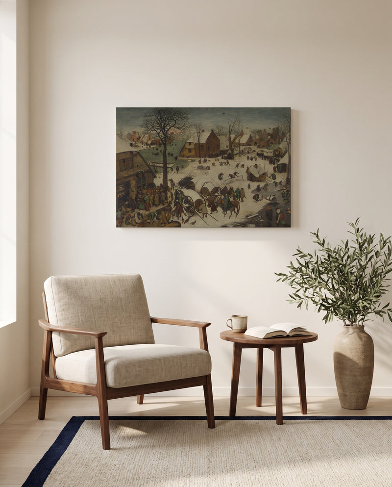 The Census at Bethlehem by Pieter Bruegel the Elder as a stretched canvas above a linen lounge chair in a reading corner