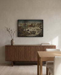 The Census at Bethlehem by Pieter Bruegel the Elder in a black frame above a walnut sideboard in a dining room