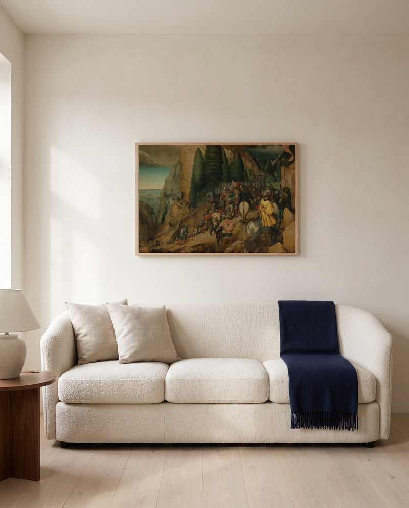 The Conversion of Paul by Pieter Bruegel the Elder framed in natural oak above a cream sofa in a warm living room