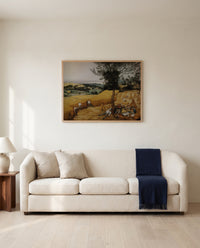 The Harvesters by Pieter Bruegel the Elder framed in natural oak above a cream sofa in a warm living room