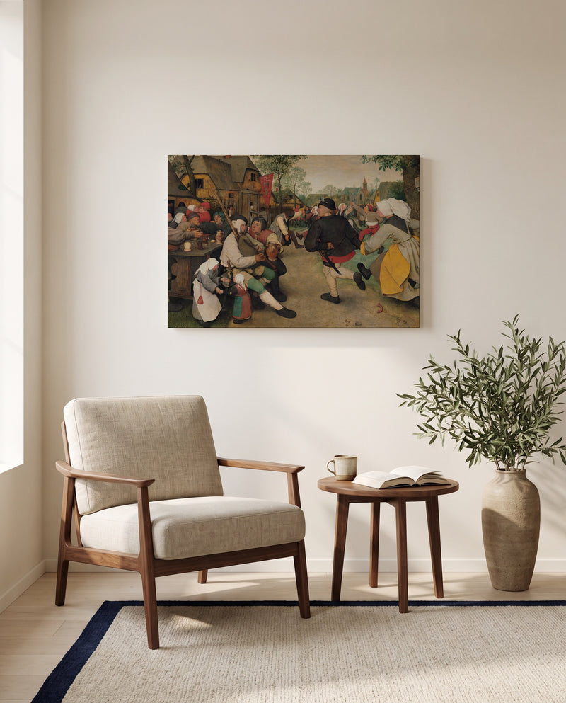 The Peasant Dance by Pieter Bruegel the Elder as a stretched canvas above a linen lounge chair in a reading corner