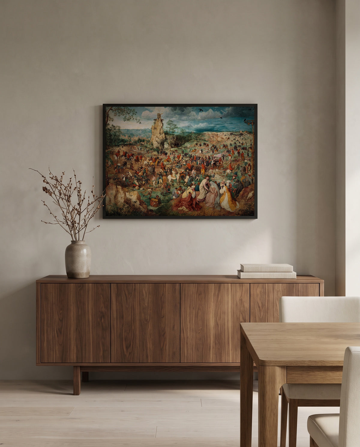 The Procession to Calvary by Pieter Bruegel the Elder in a black frame above a walnut sideboard in a dining room