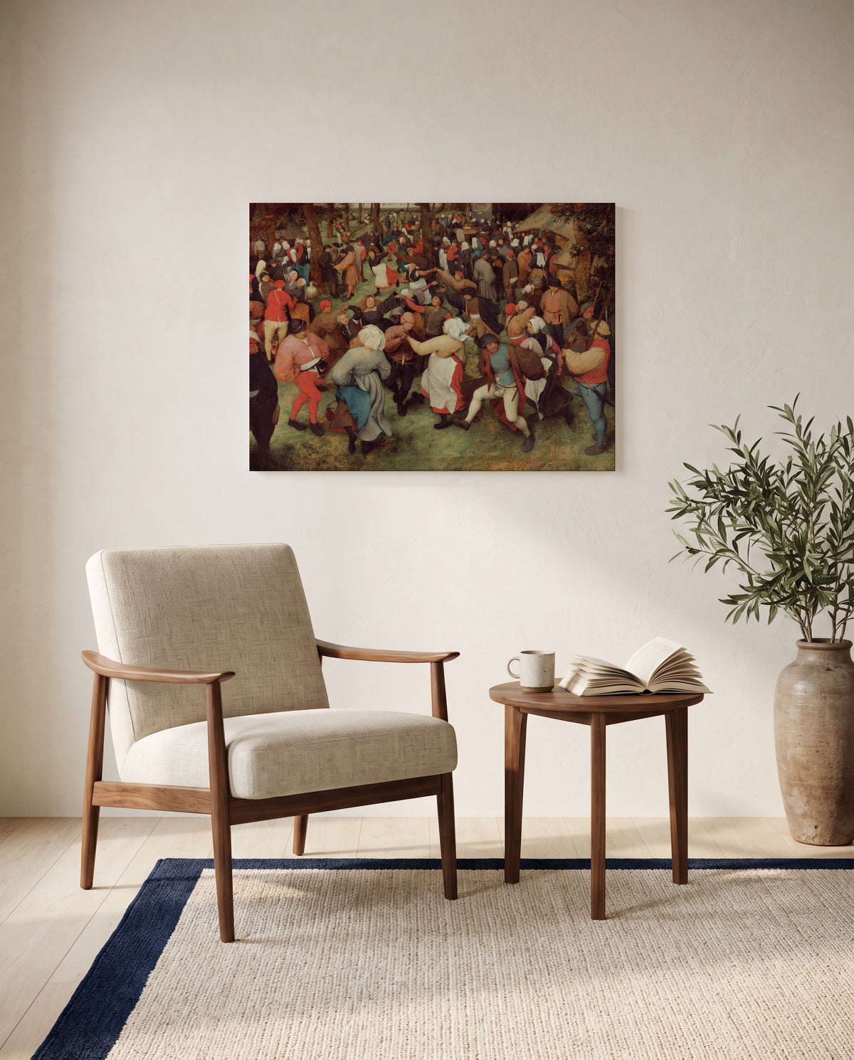 The Wedding Dance by Pieter Bruegel the Elder as a stretched canvas above a linen lounge chair in a reading corner