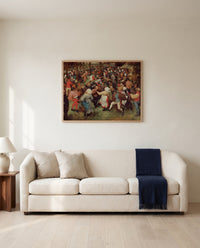 The Wedding Dance by Pieter Bruegel the Elder framed in natural oak above a cream sofa in a warm living room