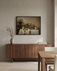 Still Life with a Fish by Pieter Claesz in a black frame above a walnut sideboard in a dining room