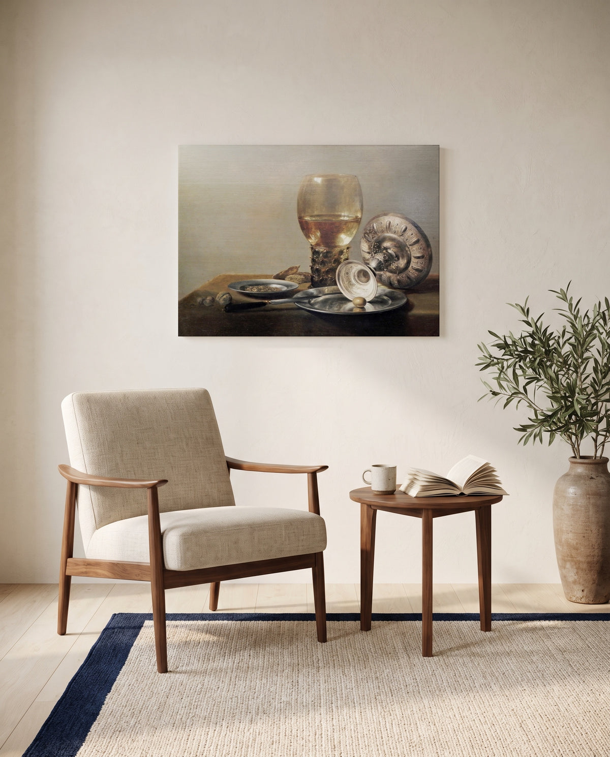 Roemer and Silver Bowl by Pieter Claesz as a stretched canvas above a linen lounge chair in a reading corner