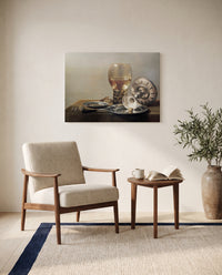 Roemer and Silver Bowl by Pieter Claesz as a stretched canvas above a linen lounge chair in a reading corner
