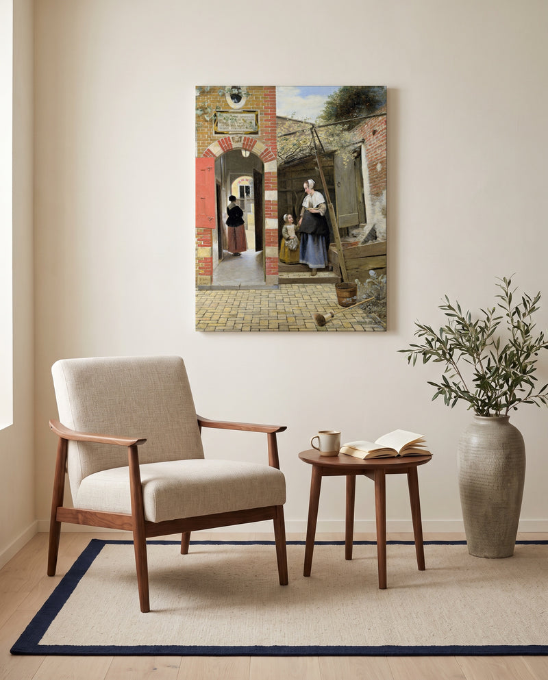Courtyard in Delft by Pieter de Hooch as a stretched canvas above a linen lounge chair in a reading corner