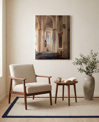 Buurkerk, Utrecht by Pieter Saenredam as a stretched canvas above a linen lounge chair in a reading corner