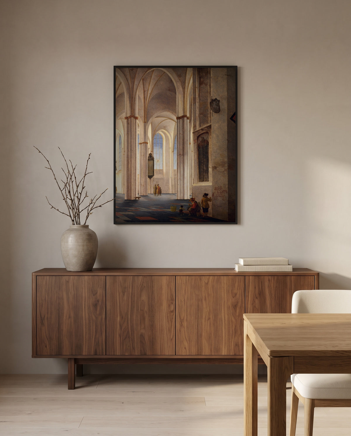 Buurkerk, Utrecht by Pieter Saenredam in a black frame above a walnut sideboard in a dining room