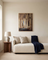 Buurkerk, Utrecht by Pieter Saenredam framed in natural oak above a cream sofa in a warm living room