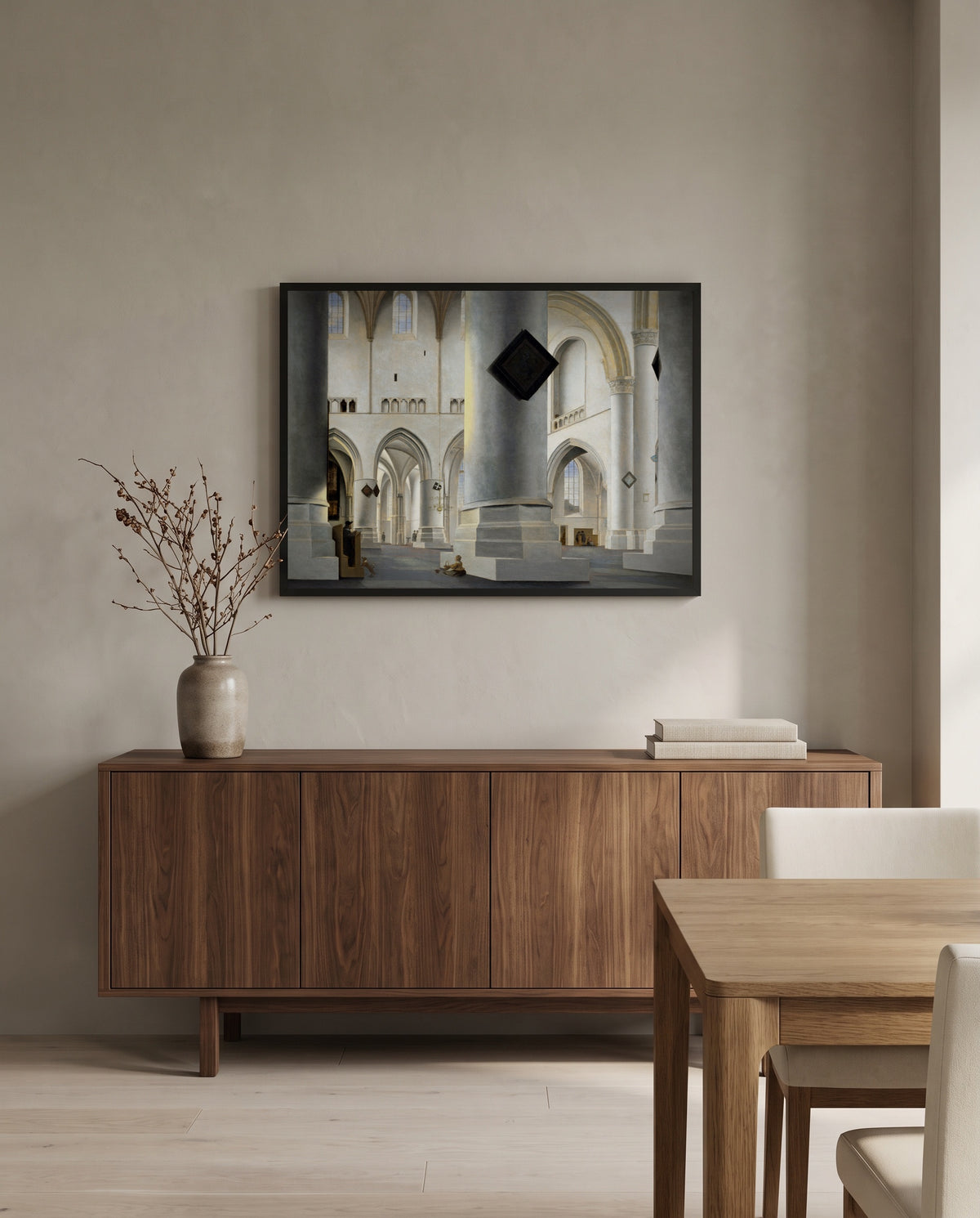 Grote Kerk, Haarlem by Pieter Saenredam in a black frame above a walnut sideboard in a dining room