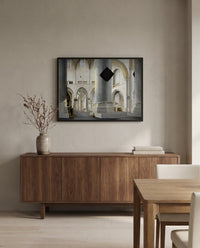 Grote Kerk, Haarlem by Pieter Saenredam in a black frame above a walnut sideboard in a dining room