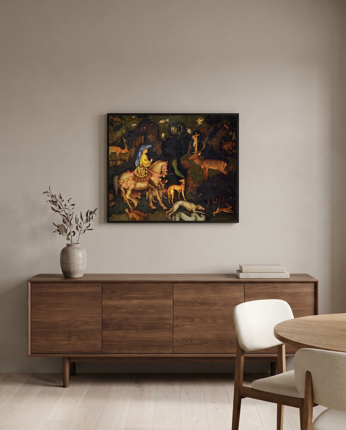Vision of Saint Eustace by Pisanello in a black frame above a walnut sideboard in a dining room