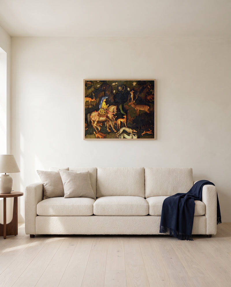 Vision of Saint Eustace by Pisanello framed in natural oak above a cream sofa in a warm living room