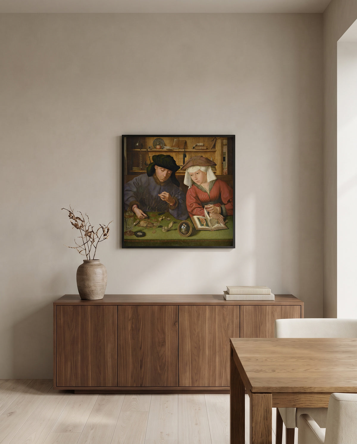 Moneylender and His Wife by Quentin Massys in a black frame above a walnut sideboard in a dining room