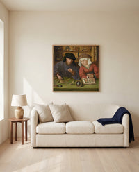 Moneylender and His Wife by Quentin Massys framed in natural oak above a cream sofa in a warm living room