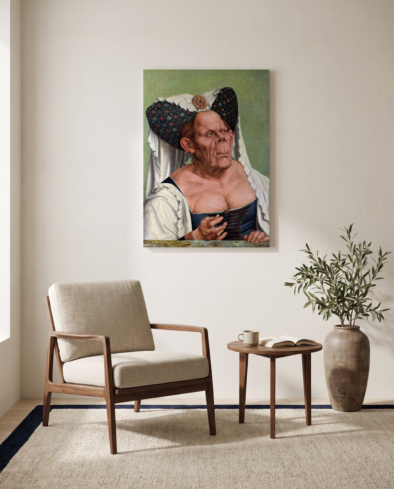The Ugly Duchess by Quentin Massys as a stretched canvas above a linen lounge chair in a reading corner