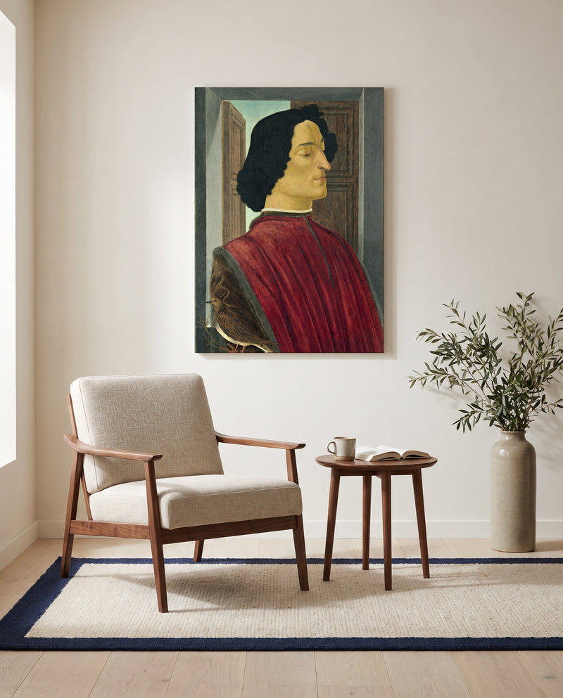 Giuliano de’ Medici by Sandro Botticelli as a stretched canvas above a linen lounge chair in a reading corner