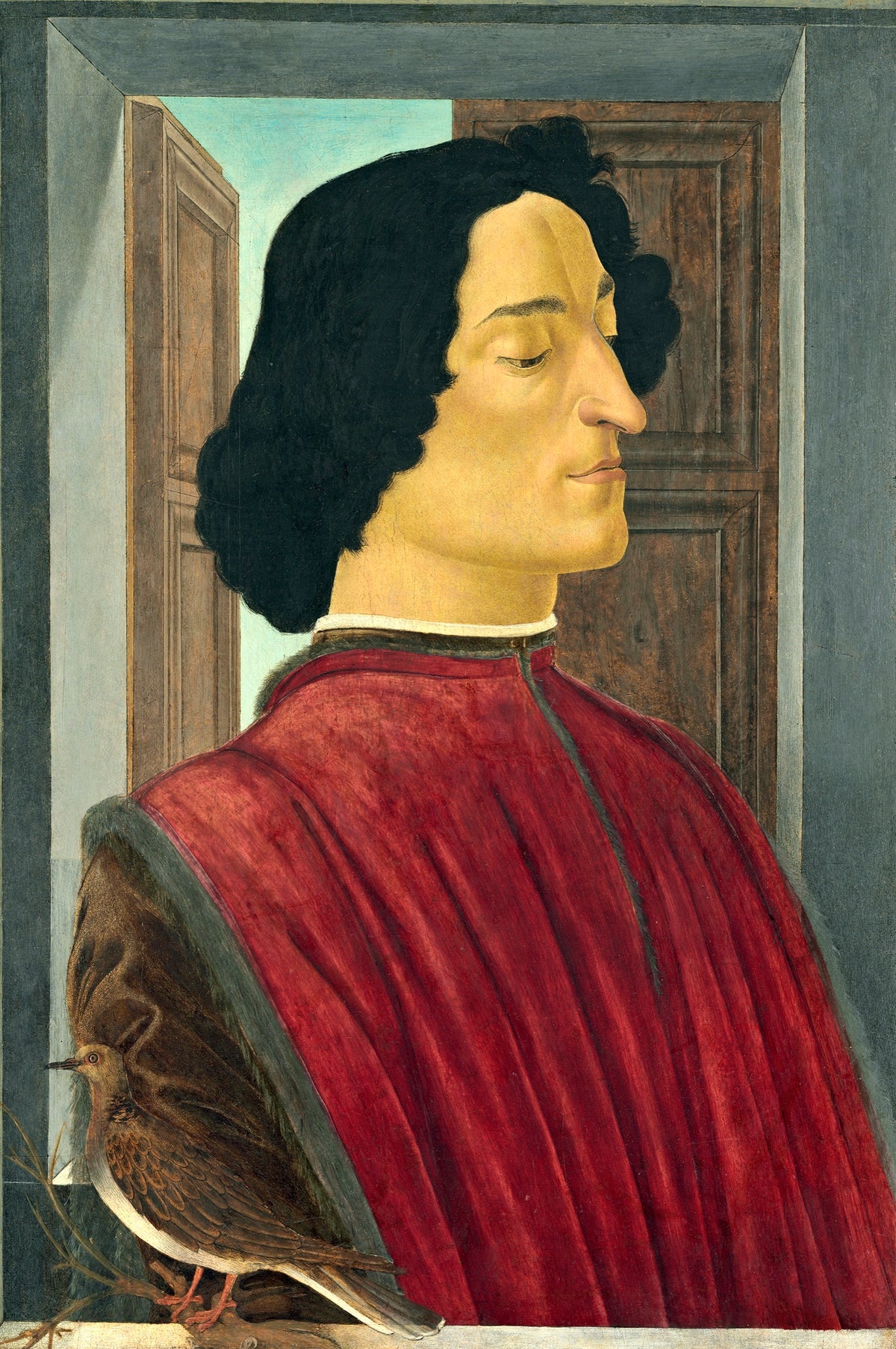 Giuliano de’ Medici by Botticelli: a dark-haired man in profile with lowered eyes, in a red robe, before an open door