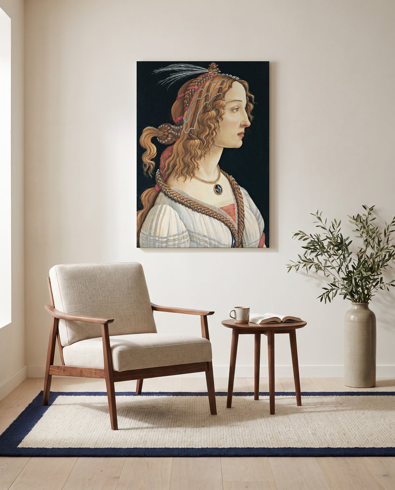Idealized Portrait of a Lady by Sandro Botticelli as a stretched canvas above a linen lounge chair in a reading corner