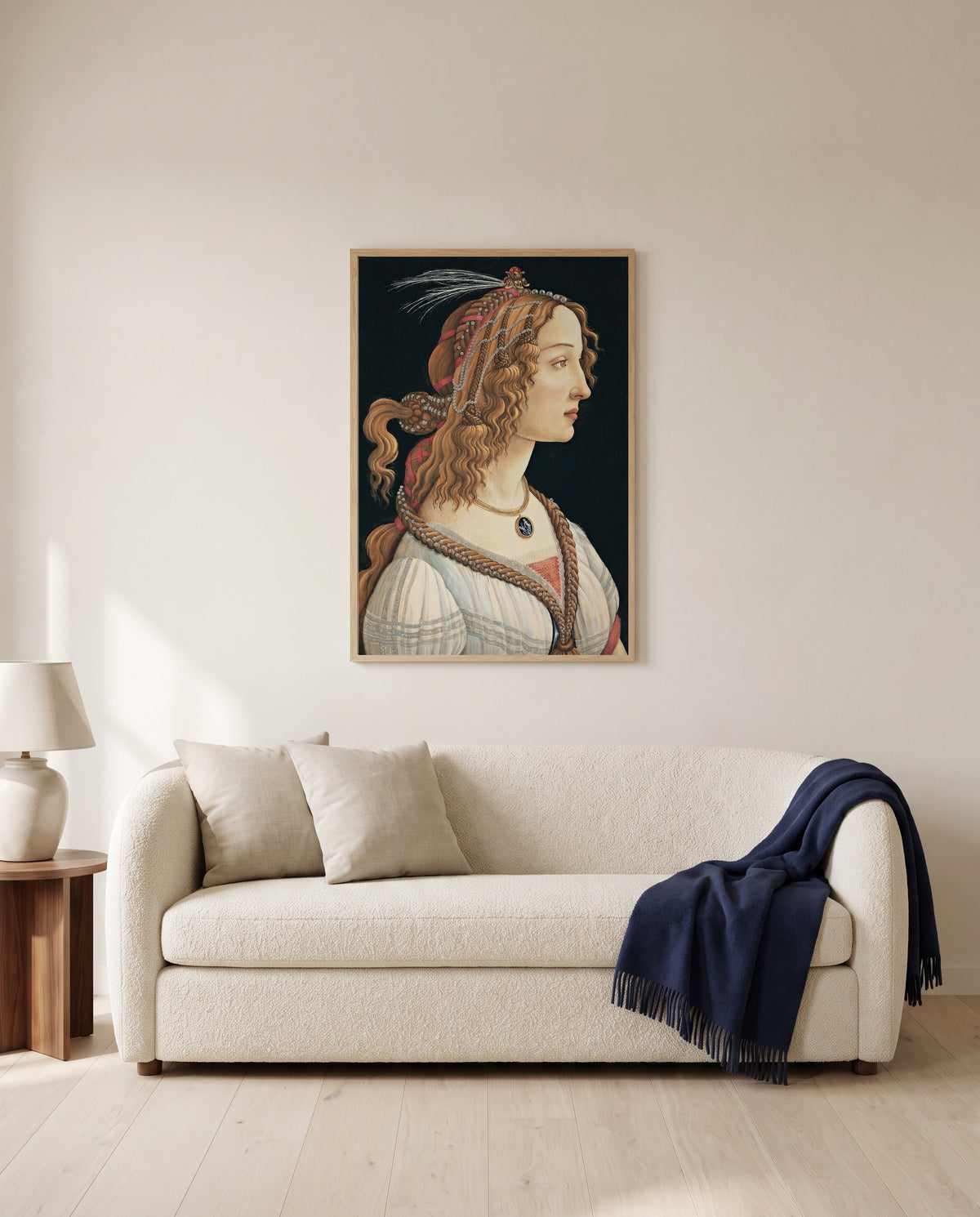 Idealized Portrait of a Lady by Sandro Botticelli framed in natural oak above a cream sofa in a warm living room