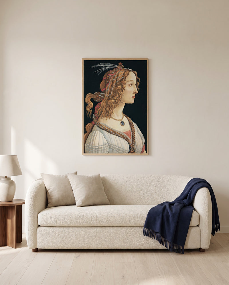 Idealized Portrait of a Lady by Sandro Botticelli framed in natural oak above a cream sofa in a warm living room