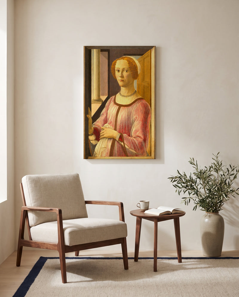 Smeralda Brandini by Sandro Botticelli as a stretched canvas above a linen lounge chair in a reading corner