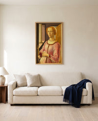 Smeralda Brandini by Sandro Botticelli framed in natural oak above a cream sofa in a warm living room