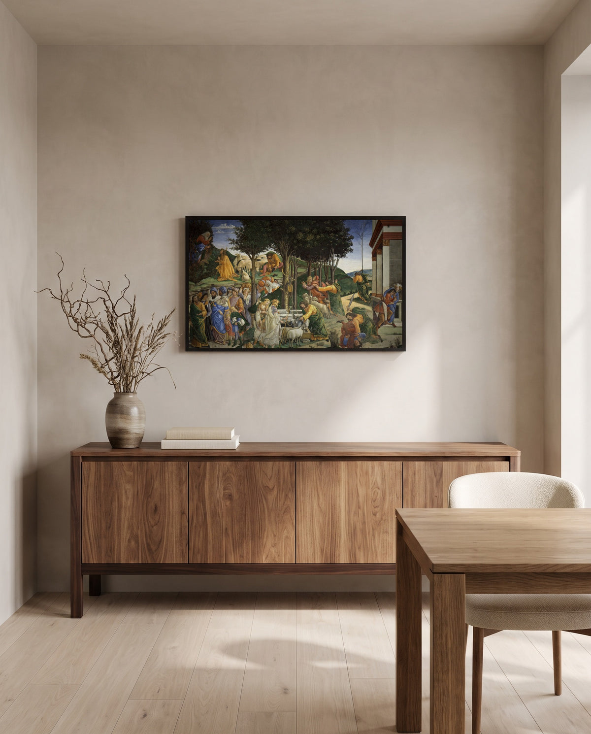 The Trials of Moses by Sandro Botticelli in a black frame in a dining room