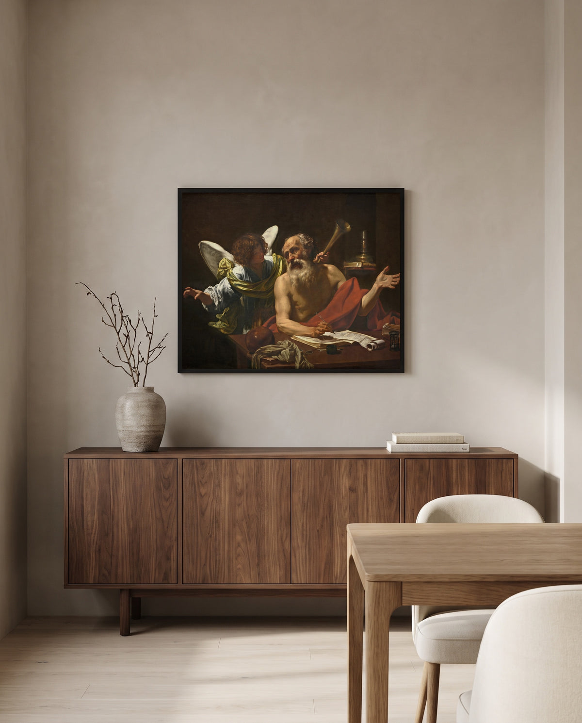 Saint Jerome and the Angel by Simon Vouet in a black frame above a walnut sideboard in a dining room