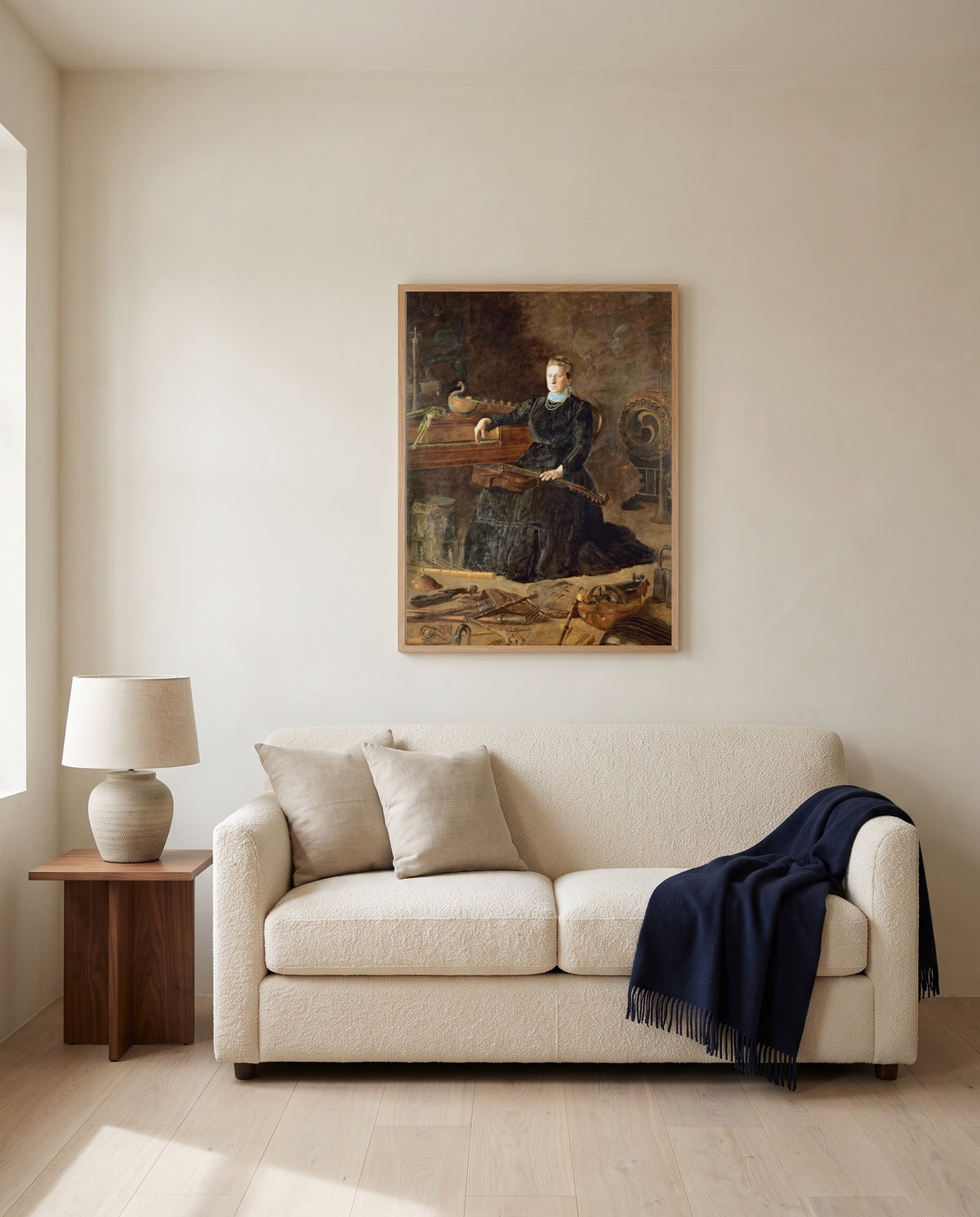 Antiquated Music by Thomas Eakins framed in natural oak above a cream sofa in a warm living room