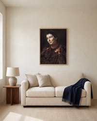 Mary Adeline Williams by Thomas Eakins framed in natural oak above a cream sofa in a warm living room
