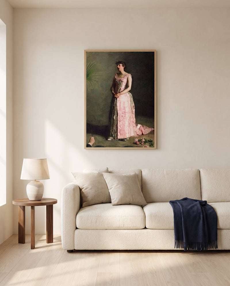 The Concert Singer by Thomas Eakins framed in natural oak above a cream sofa in a warm living room