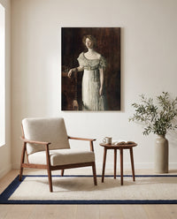 The Old-Fashioned Dress by Thomas Eakins as a stretched canvas above a linen lounge chair in a reading corner